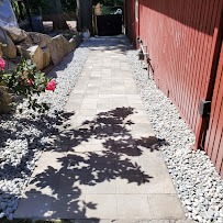 Stone paver walkway with rock border and gravel edges